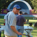 The CCI grill master enjoy the concert while cookin' some hotdogs